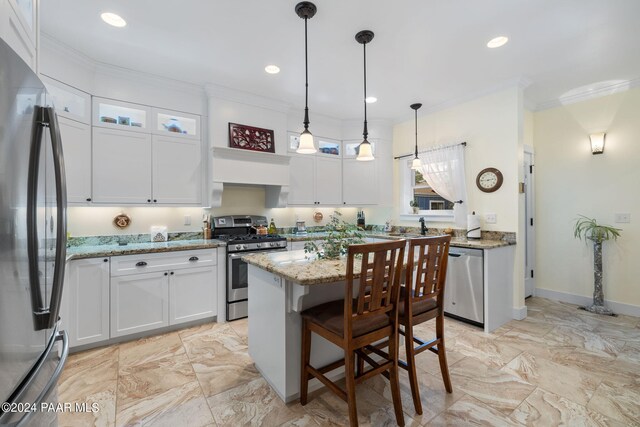 kitchen featuring appliances with stainless steel finishes, white cabinetry, glass insert cabinets, and light stone countertops