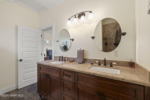 bathroom with double vanity, a sink, and crown molding