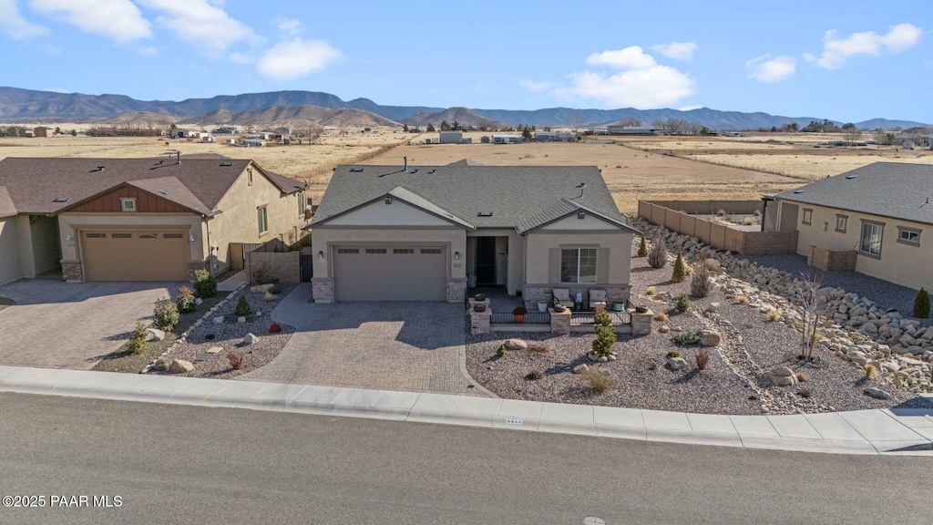 ranch-style house featuring a mountain view and a garage