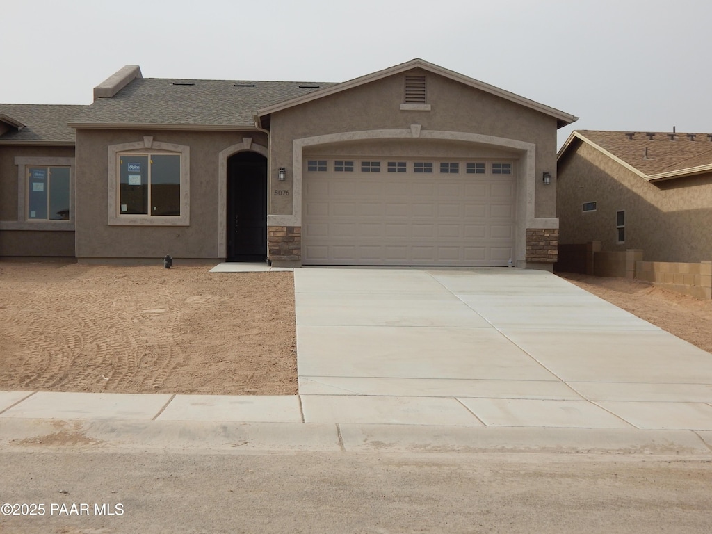 view of front of property featuring a garage