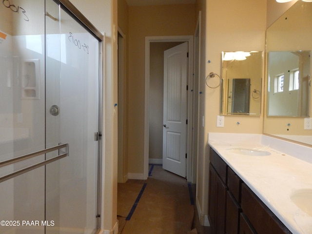 bathroom with vanity, tile patterned flooring, and walk in shower