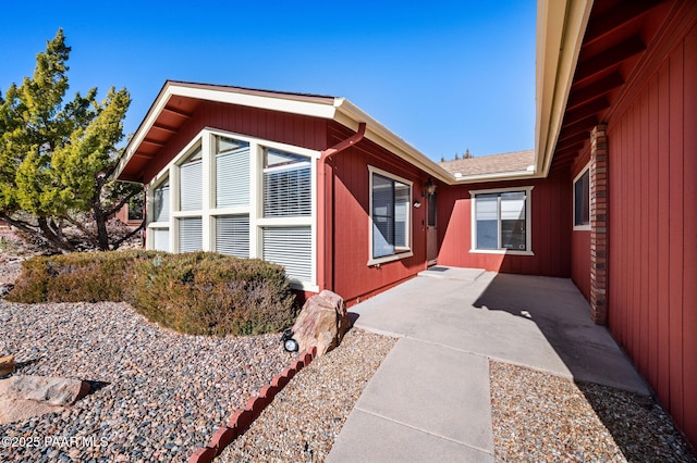 view of side of home featuring a patio area