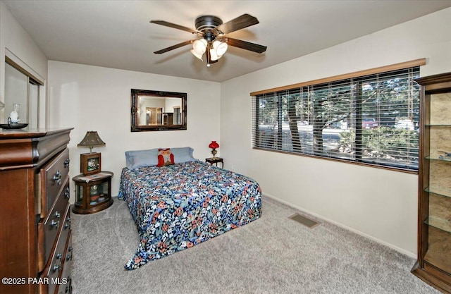 bedroom with ceiling fan and carpet