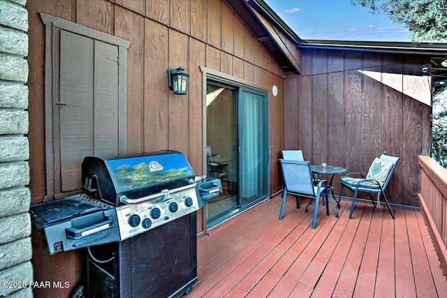 deck featuring a grill