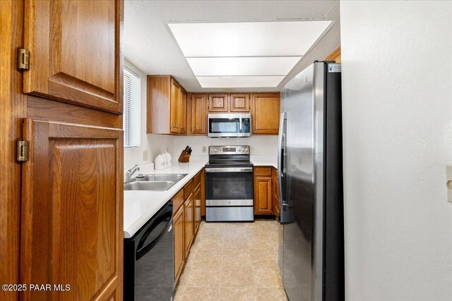 333 W Leroux St Unit D4, Prescott, AZ 86303 - kitchen with stainless steel appliances, brown cabinets, and light countertops