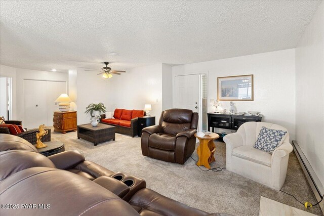 333 W Leroux St Unit D4, Prescott, AZ 86303 - living area with carpet flooring, a baseboard radiator, ceiling fan, and a textured ceiling