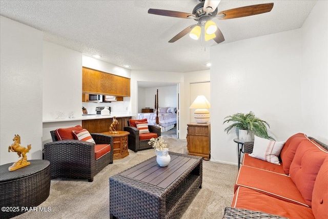 333 W Leroux St Unit D4, Prescott, AZ 86303 - living area with light colored carpet, a ceiling fan, a textured ceiling, and recessed lighting