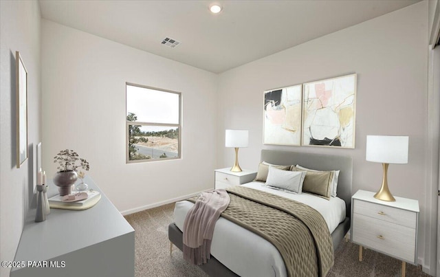 carpeted bedroom featuring visible vents and baseboards