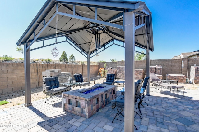 view of patio with a gazebo and an outdoor fire pit