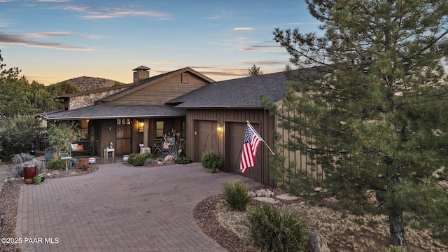 view of front of home featuring a mountain view and a garage