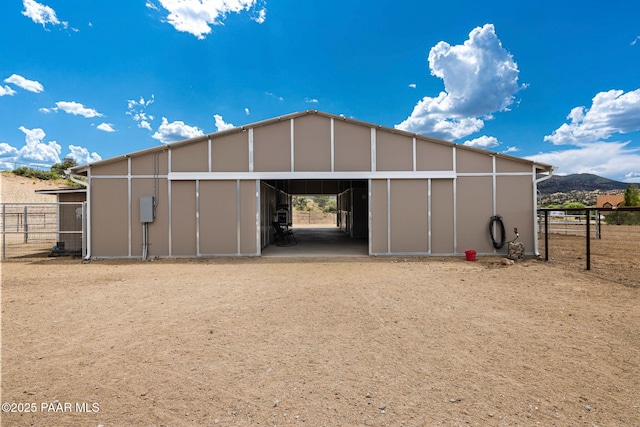 view of outbuilding featuring a mountain view