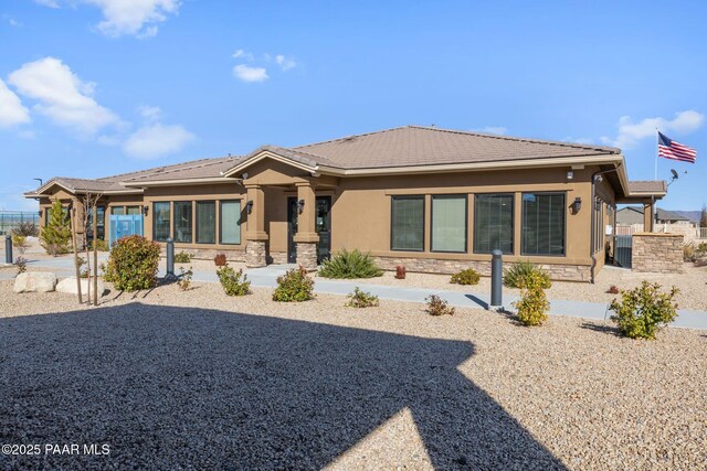 5486 N Jarvis Ct, Prescott Valley, AZ 86314 - view of front of home with a tile roof, stone siding, and stucco siding