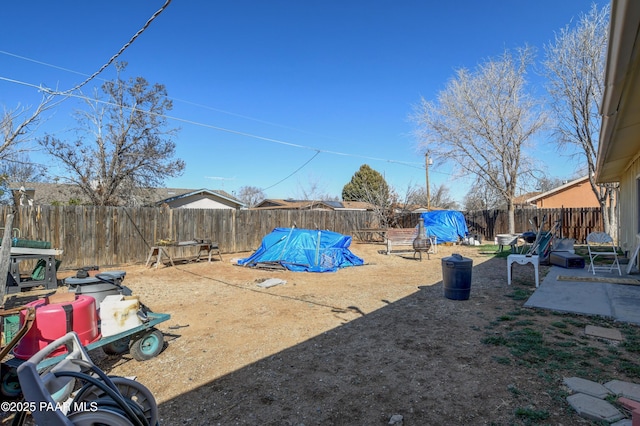 view of yard featuring a fenced backyard and a patio