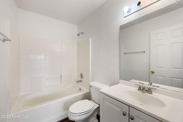 bathroom with shower / bathtub combination, toilet, and vanity