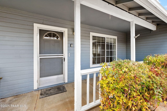 property entrance featuring covered porch