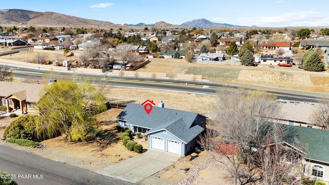 birds eye view of property with a mountain view and a residential view