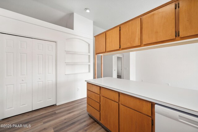 unfurnished dining area featuring an inviting chandelier, visible vents, dark wood-style flooring, and baseboards