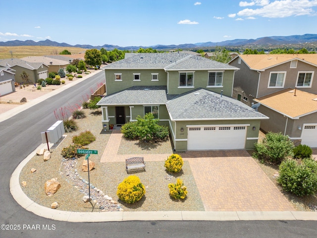 13109 E Gonzalez St, Dewey-Humboldt, AZ 86327 - traditional-style house with roof with shingles, stucco siding, a garage, and a mountain view