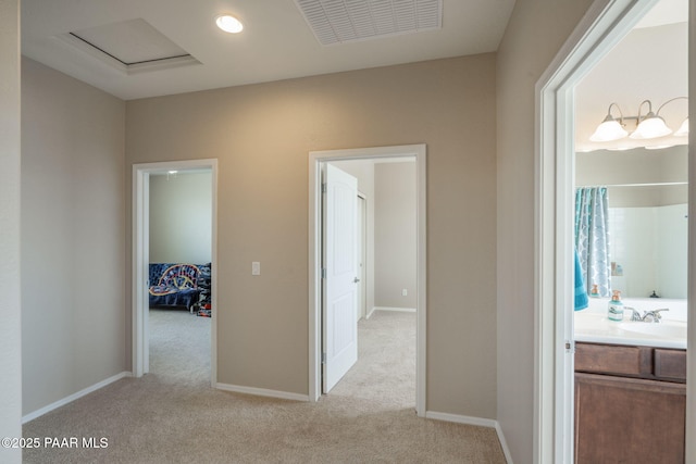 13109 E Gonzalez St, Dewey-Humboldt, AZ 86327 - hall with light carpet, a sink, and baseboards
