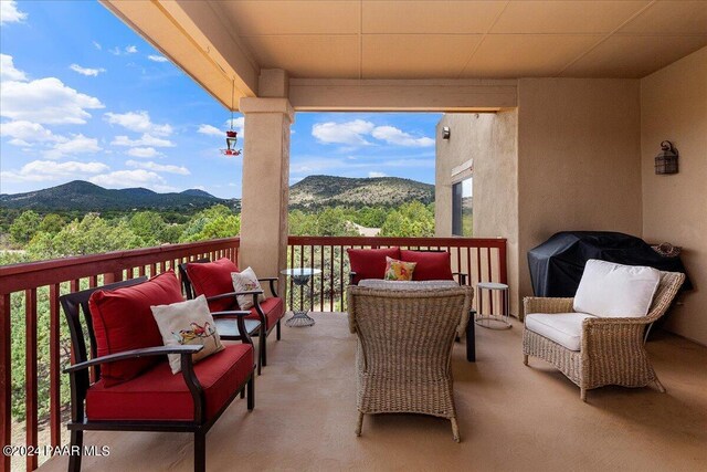 balcony featuring a mountain view