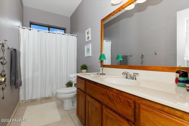 bathroom featuring tile patterned flooring, vanity, and toilet