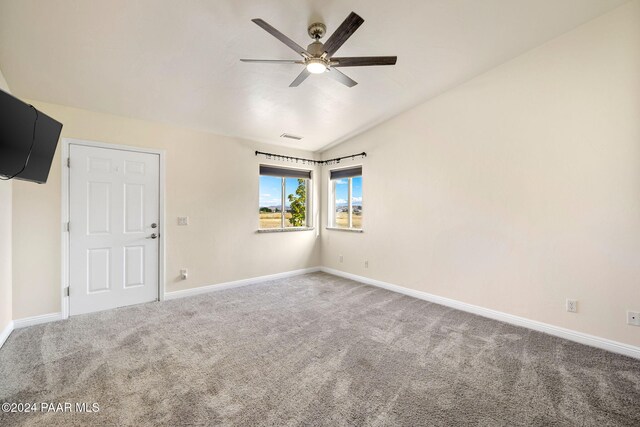 unfurnished bedroom with carpet, a walk in closet, ceiling fan, connected bathroom, and a closet