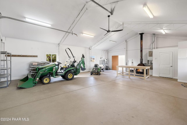 garage featuring ceiling fan and baseboards