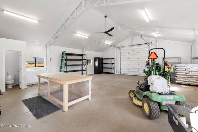 garage with a ceiling fan and freestanding refrigerator