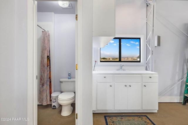 full bath with concrete flooring, curtained shower, vanity, and toilet