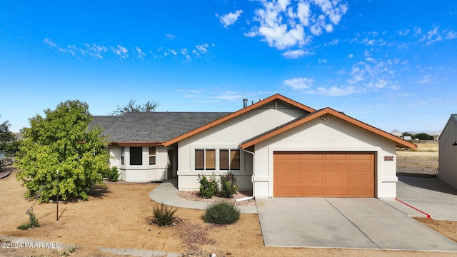 ranch-style home featuring a garage