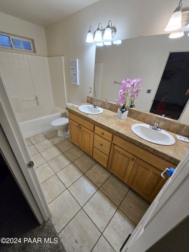 full bathroom with tile patterned floors, vanity, toilet, and shower / washtub combination