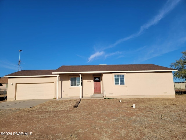 ranch-style home with a garage