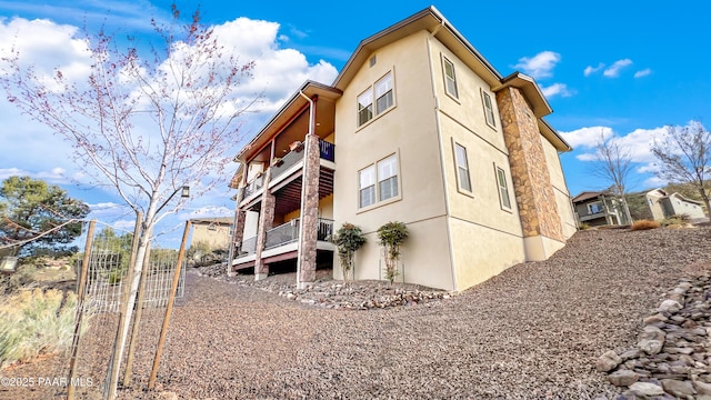 4374 Hornet Dr, Prescott, AZ 86301 - back of house featuring stucco siding and a balcony