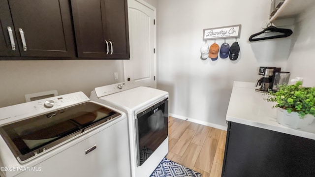 4374 Hornet Dr, Prescott, AZ 86301 - laundry room featuring washer and clothes dryer, cabinet space, baseboards, and light wood-type flooring