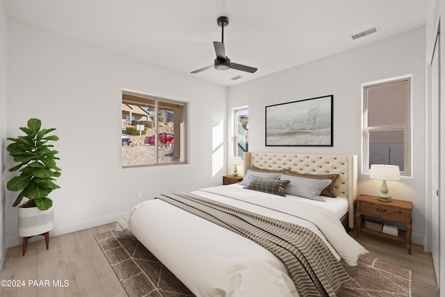 bedroom featuring light wood-type flooring and ceiling fan