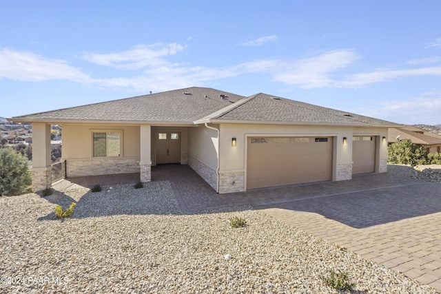 prairie-style house featuring a garage