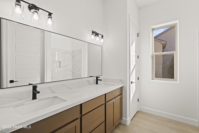 bathroom with hardwood / wood-style floors and vanity