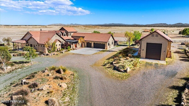 3825 W Wig Wag Way, Prescott, AZ 86305 - view of front of property featuring driveway, a mountain view, stucco siding, and a garage