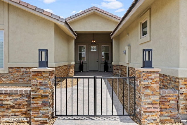 3225 Pamela St, Prescott, AZ 86305 - doorway to property featuring stucco siding, stone siding, and covered porch