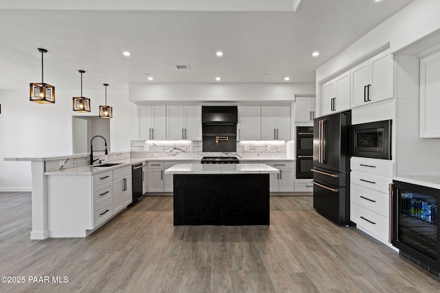 3225 Pamela St, Prescott, AZ 86305 - kitchen featuring black appliances, a sink, wine cooler, a peninsula, and wood finished floors