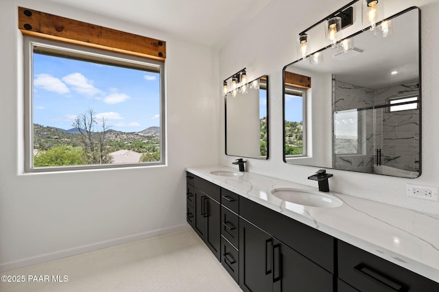 3225 Pamela St, Prescott, AZ 86305 - bathroom featuring double vanity, a marble finish shower, baseboards, and a mountain view