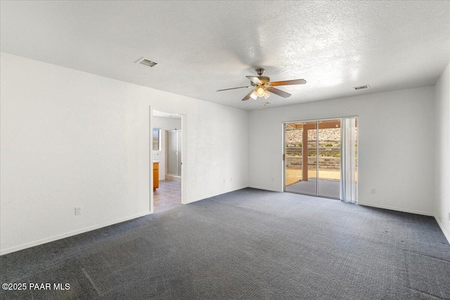 20775 N Hackamore Ln, Paulden, AZ 86334 - carpeted spare room featuring ceiling fan, baseboards, and a textured ceiling