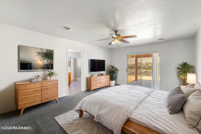 20775 N Hackamore Ln, Paulden, AZ 86334 - carpeted bedroom featuring access to exterior, a ceiling fan, and ensuite bath