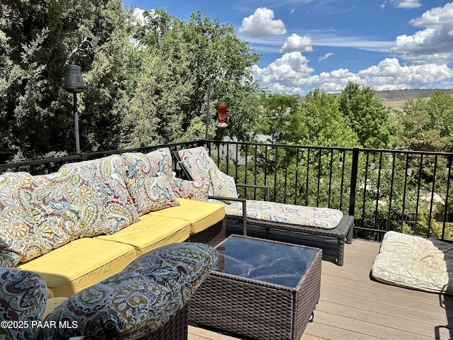 deck with an outdoor hangout area