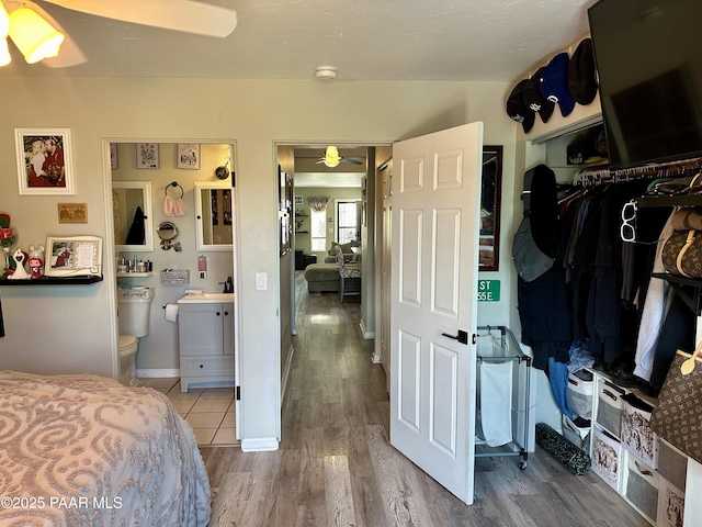 bedroom with hardwood / wood-style flooring and ceiling fan