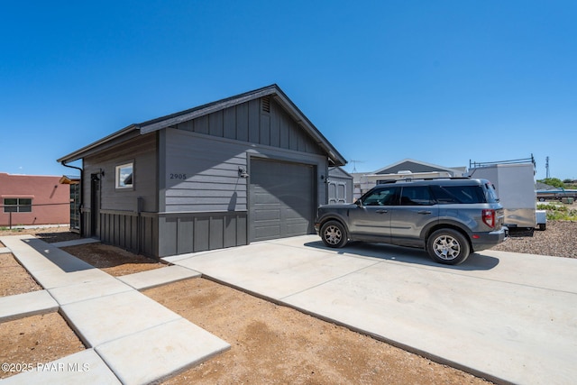 2905 S Omega Dr, Dewey-Humboldt, AZ 86329 - view of front of house featuring board and batten siding, a garage, and driveway