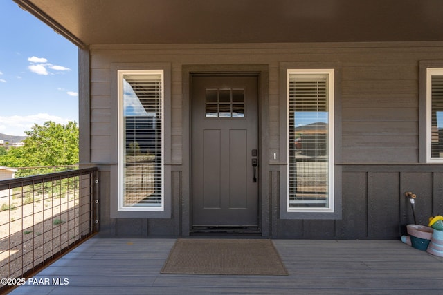 2905 S Omega Dr, Dewey-Humboldt, AZ 86329 - view of exterior entry featuring board and batten siding and a balcony
