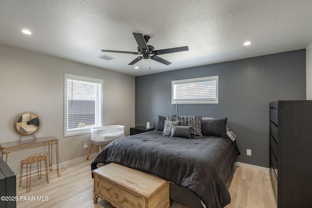 2905 S Omega Dr, Dewey-Humboldt, AZ 86329 - bedroom with light wood-type flooring, multiple windows, recessed lighting, baseboards, and a ceiling fan
