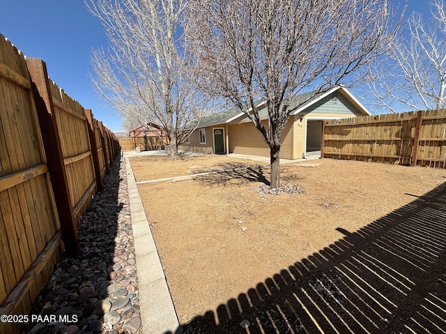 view of yard with a fenced backyard