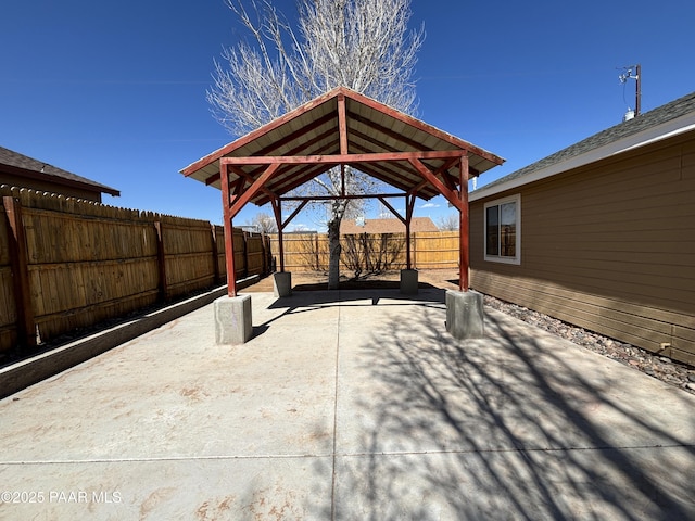 view of patio / terrace with a gazebo and a fenced backyard